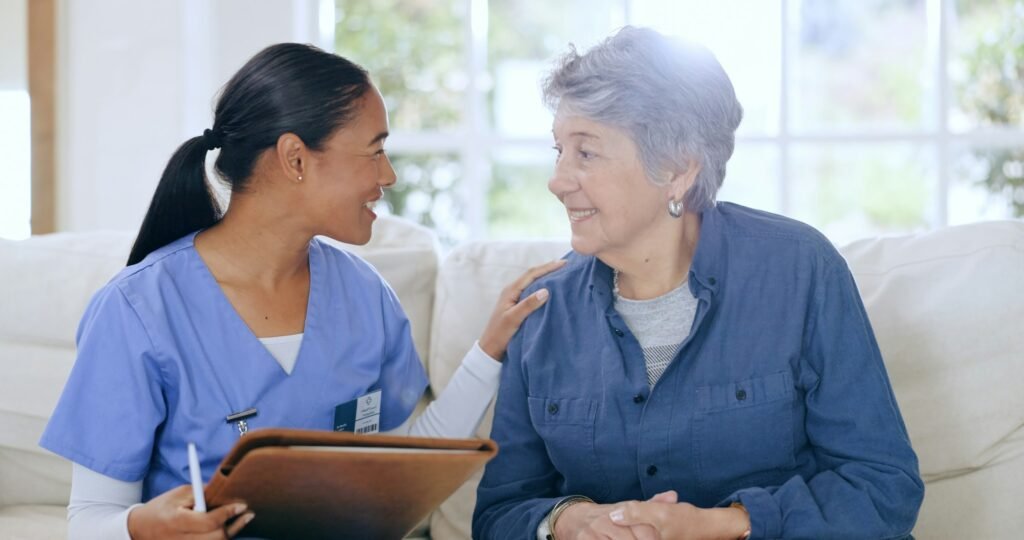 Sofa, consulting and nurse with senior woman in home for medical care, support and service. Healthc